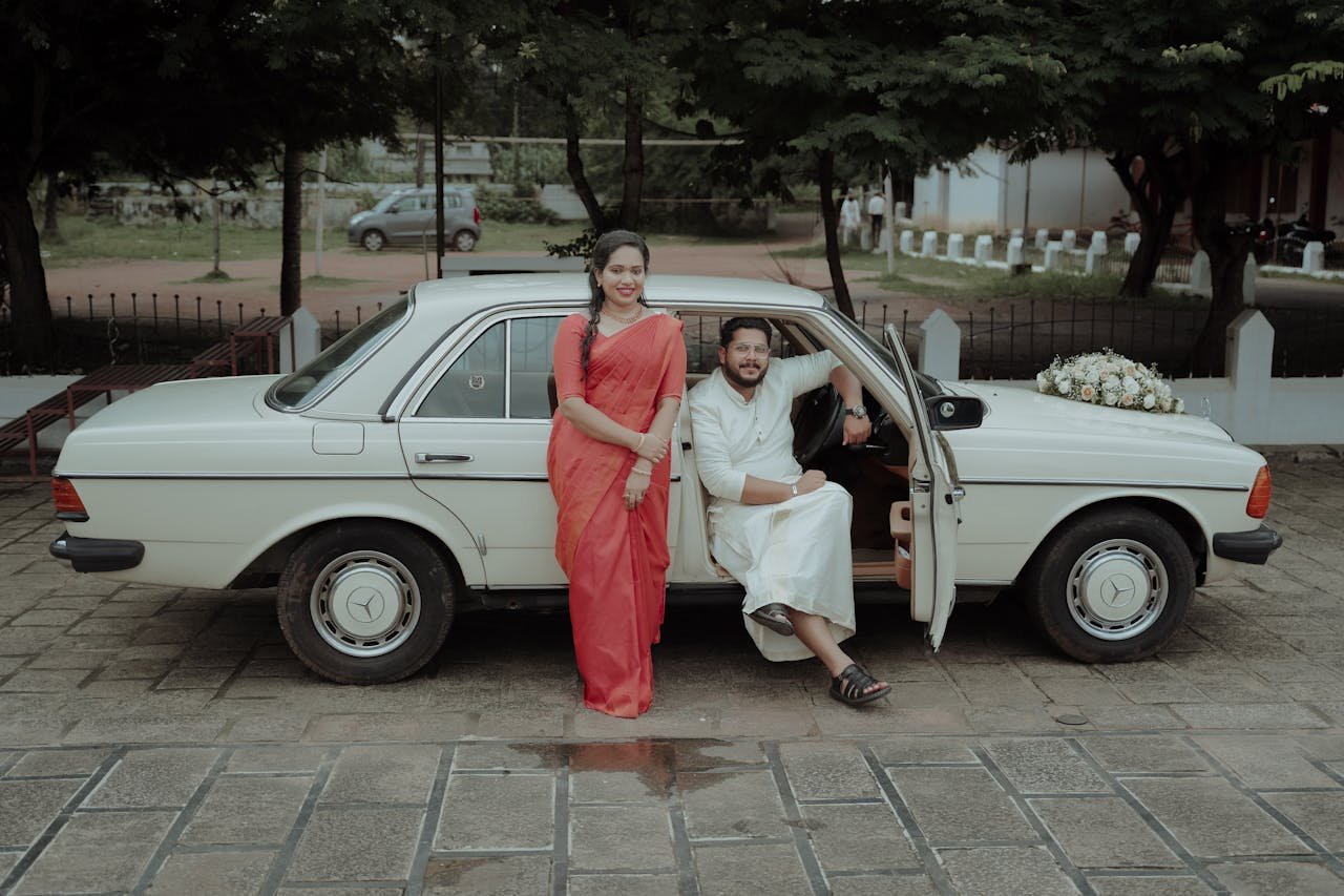 Bride and Groom in Car with Wedding Decoration